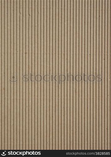 Corrugated cardboard. Brown corrugated cardboard useful as a background