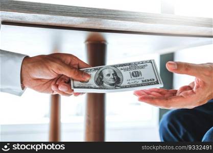 Corruption and Bribery,Businessman giving dollar bills corruption bribery to business manager to deal contract