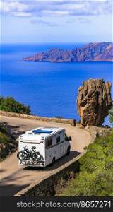 Corsica isalnd senery, road travel by c&er. Famous national park Calanques della Piana, with stunning red rocks