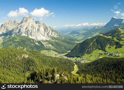 Corvara. Green valley with the village of Corvara in the dolomities