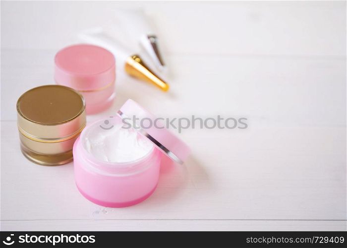 cosmetic and skin care product on white wood table, beauty with treatment cream and moisturizer on wooden desk, health and wellness concept.