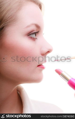 Cosmetic beauty procedures and makeover concept. Closeup part of woman face red lips. Make-up artist applying lipstick with accessories tools.