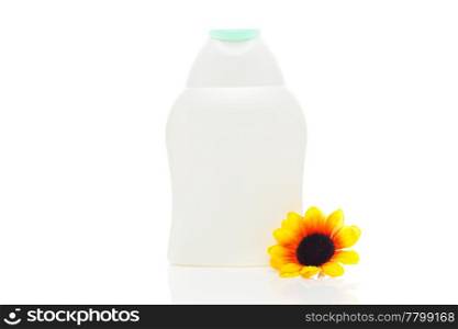 cosmetic containers and flower isolated on white