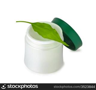 cosmetic cream and green leaf isolated on white backgrounds