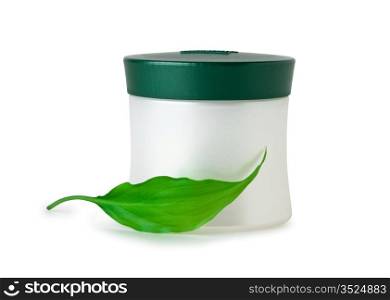 cosmetic cream and green leaf isolated on white backgrounds