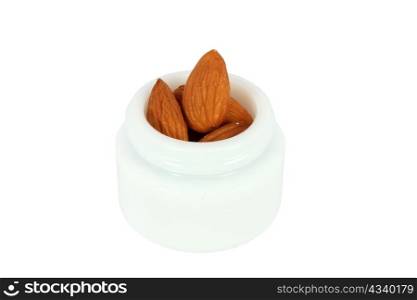 Cosmetic cream with almonds isolated on white