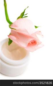 cosmetic cream with the scent flower roses isolated on a white background