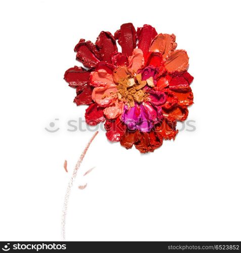 Cosmetic flower.. Creative concept photo of cosmetics swatches in the shape of flower on white background.