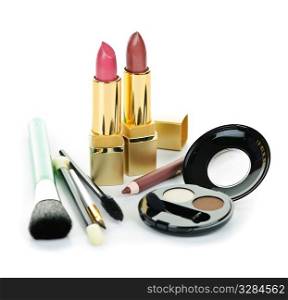 Cosmetic makeup kit with brushes isolated on white background