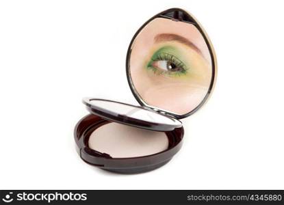 Cosmetic powder with woman eye at mirror isolated on red background