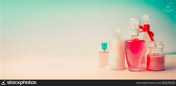 Cosmetic products banner. Different cosmetic bottles collection on Beautiful pink turquoise blue background, front view. Cosmetic shop, Beauty, skin and hair care or spa treatment concept