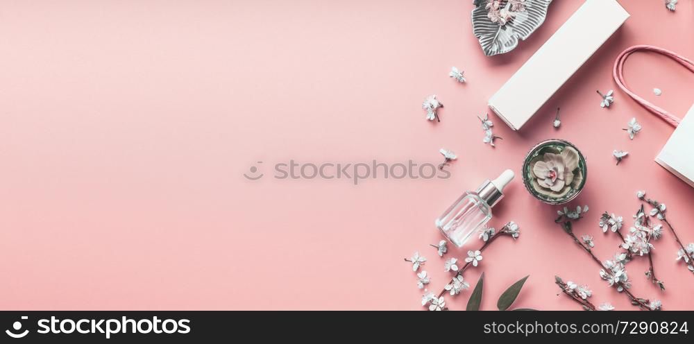 Cosmetics coral background. Mock up of skin care products with shopping bag and spring blossom. Beauty blog layout. Pastel color. Flat lay. Banner or template