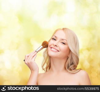 cosmetics, health and beauty concept - beautiful woman with closed eyes and makeup brush