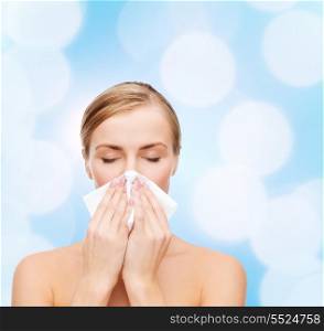 cosmetics, health and beauty concept - beautiful woman with paper tissue and closed eyes