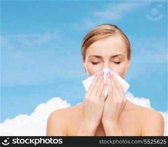 cosmetics, health and beauty concept - beautiful woman with paper tissue and closed eyes