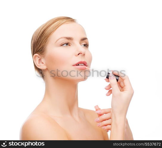 cosmetics, health and beauty concept - beautiful woman with pink lipgloss