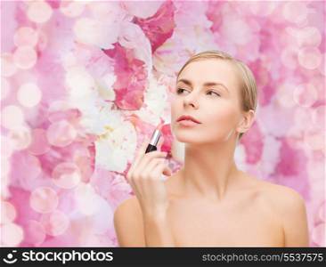 cosmetics, health and beauty concept - beautiful woman with pink lipstick