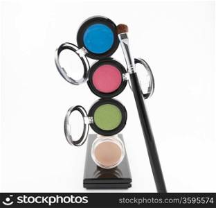 Cosmetics, makeup and brush isolated on white background