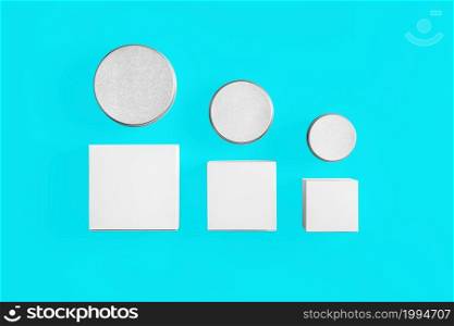 Cosmetics mockup template on blue toscha background. Plastic container for cosmetics products. Tube, cream pot, beauty products isolated on white background. 3D rendering.