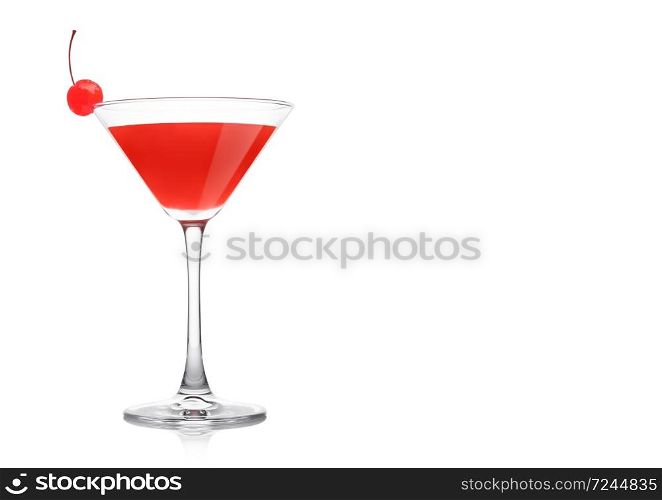 Cosmopolitan cocktail in classic crystal glass with pink cherry on white background. Space for text