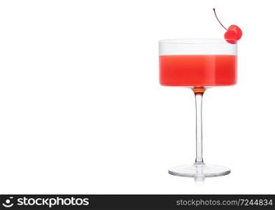 Cosmopolitan cocktail in modern crystal glass with pink cherry on white background. Space for text