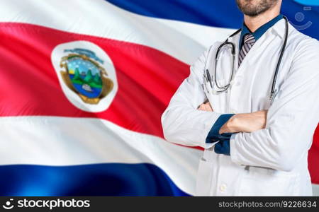 Costa Rica national health concept. Doctor with crossed arms on Costa Rica flag, Health and care with flag of Costa Rica
