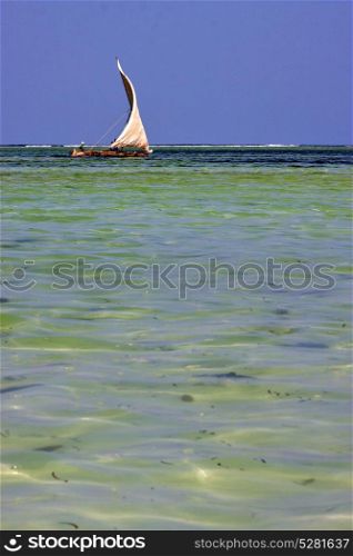costline boat pirague in the blue lagoon relax of zanzibar africa