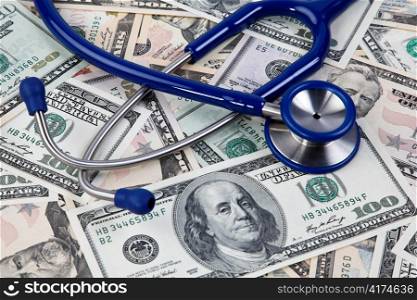 costs for healthcare, stethoscope and dollar bills