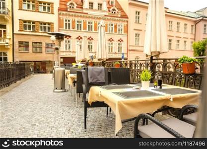 Cosy outdoor cafe with rattan furniture, Karlovy Vary, Czech Republic, Europe. Old european town, famous place for travel. Outdoor cafe with rattan furniture, Karlovy Vary