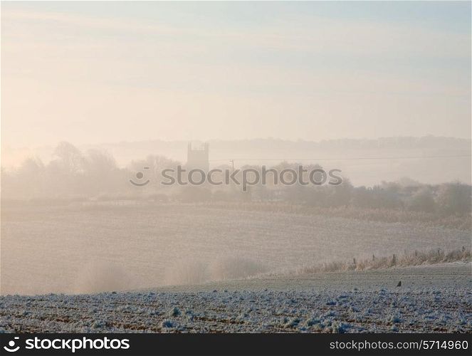 Cotswolds winter morning looking towards Chipping Campden through the mist, Gloucestershire, England.