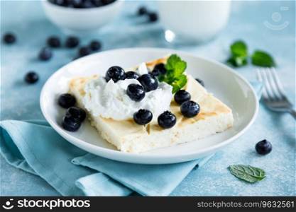 Cottage cheese cheesecake slice with fresh blueberry