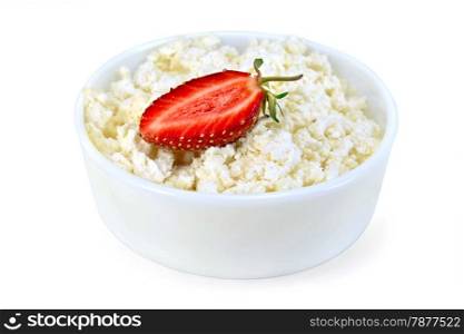 Cottage cheese in a white bowl with strawberries isolated on white background