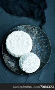 cottage cheese on plate and on a table