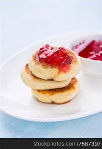 Cottage cheese pancakes with currant jam, selective focus