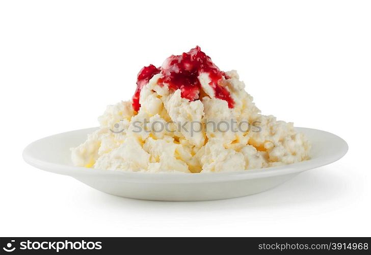 Cottage cheese with raspberry jam isolated on a white background