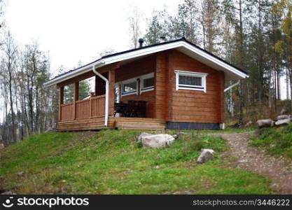 cottage in forest on hill