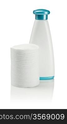 cotton pads and white bottle