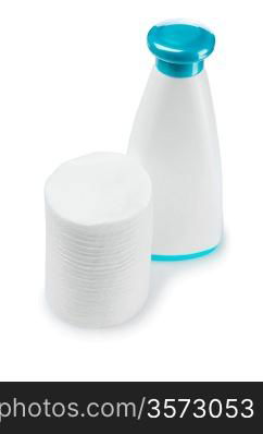 cotton pads and white plastic bottle