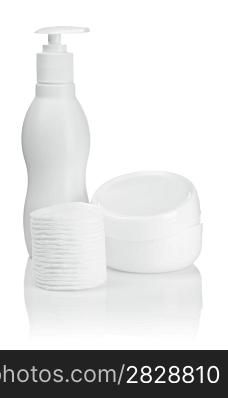 cotton pads bottle and cream