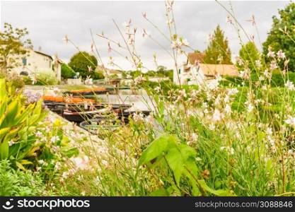 Coulon small town in France. View on river with boats. Coulon small town in France