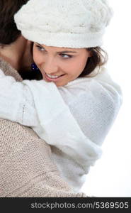 Coulpe enjoying winter hug