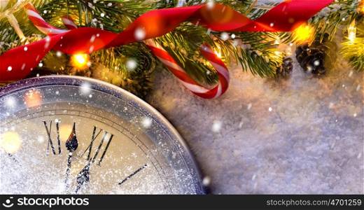 Countdown to midnight. Countdown to midnight. Retro style clock counting last moments before Christmas or New Year 2017 next to decorated fir tree. View from above.