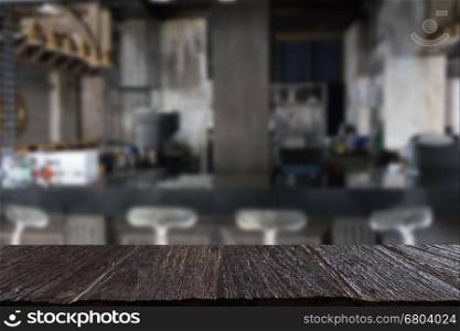 counter bar in restaurant interior blur background with selected focus empty wood table for display or montage your product