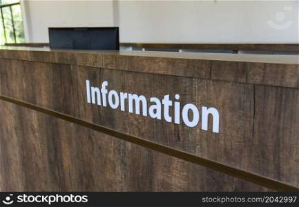 counter information, text information on wooden table in the office building