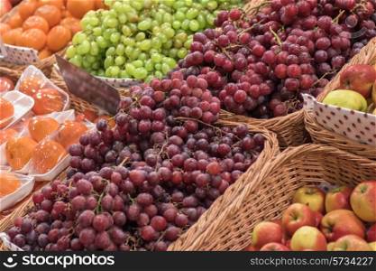 Counter with ripe grapes in supermarket