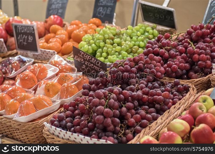 Counter with ripe grapes in supermarket . supermarket