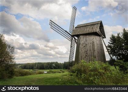 Country landscape with old windmill in Mikhailovskoe village, Museum-reserve of A.S. Pushkin, Pskov region, Russia