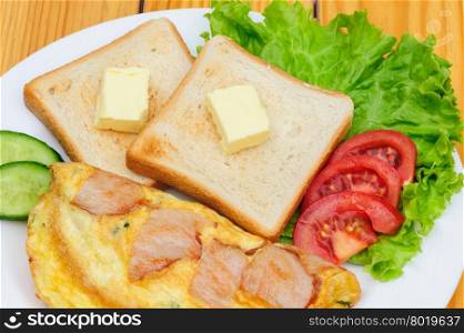 country omelette with bacon, salad and toasts