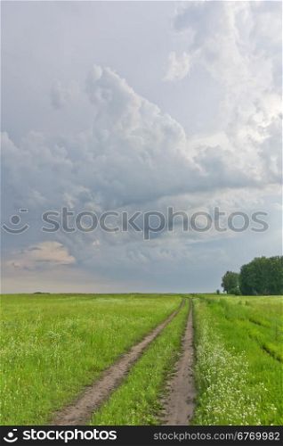 country road and rainy clouds