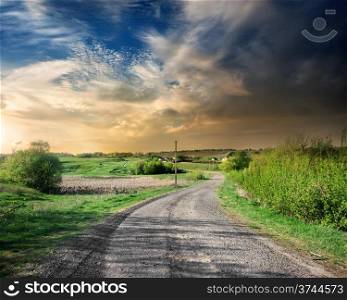 Country road in the countryside at sunset